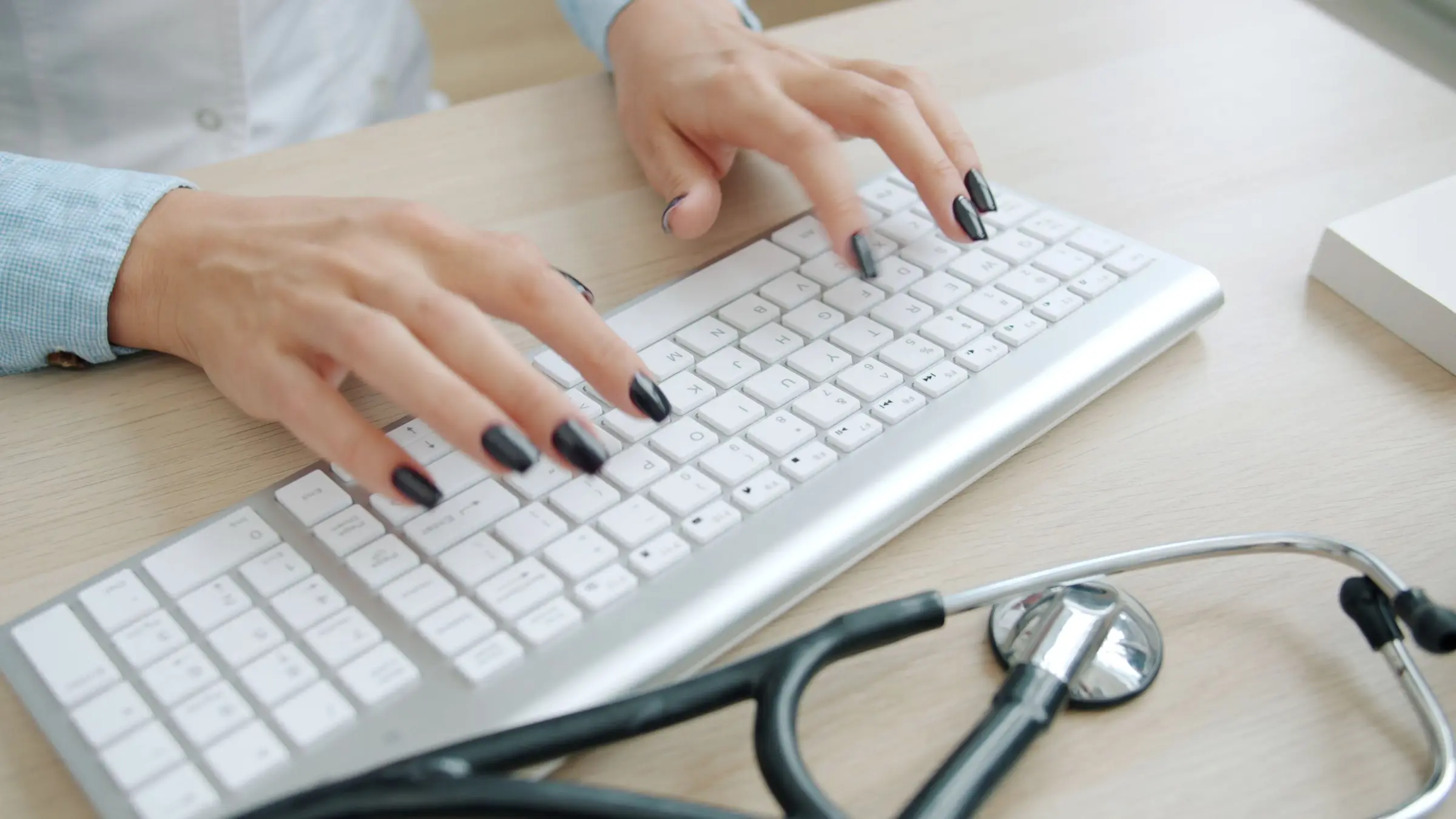 Healthcare Professional Typing on Keyboard